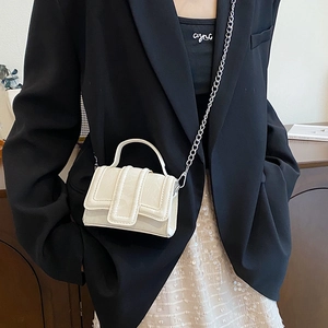 Mini white crossbody bag with silver chain strap and top handle for women