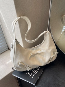Creamy white balletcore shoulder bag with pleated texture and sweet bow details