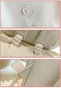 Close-up of waterproof cream fabric and durable strap buckles on the large backpack