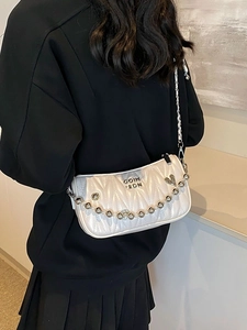 Quilted white crossbody bag with stylish silver ball chain strap and metallic finish