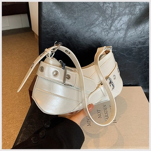 Detailed view of the white hobo underarm bag with silver buckles and eyelet straps