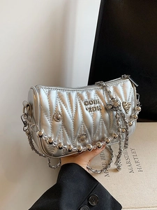 Chic silver quilted chain bag with metallic heart star charms and beaded strap