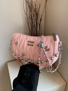 Pink quilted crossbody bag with heart pendant and metallic beaded chain strap