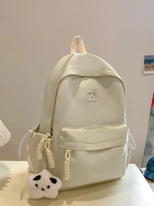 Minimalist cream white nylon backpack with cute bear patch and plush star charm accessory