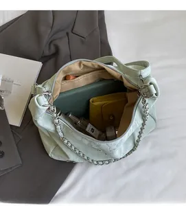 Interior view of mint green tote bag showing spacious capacity for tablet and accessories