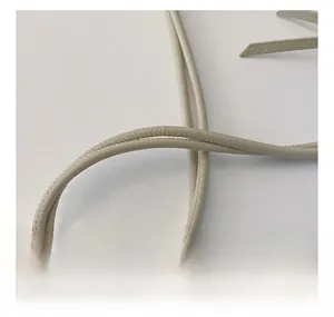 Detailed close-up of a beige leather shoulder strap with premium stitched texture