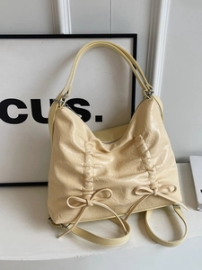 Borsa a tracolla vintage in pelle crema con fiocchi e pieghe di marca Nordborg