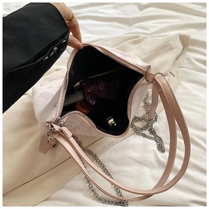 Interior detail of pink floral bear tote bag showing storage for makeup and accessories