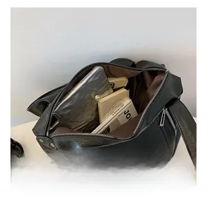 Top view of large black tote bag showing spacious interior for tablet and daily items