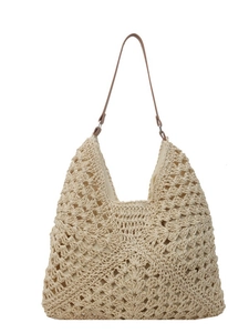 Handwoven straw tote bag in cream white with brown leather straps for summer beach vacation