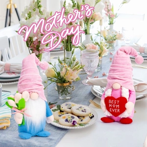 Detail view of Mother's Day gnomes with tulips and Best Mom Ever heart on a dining table