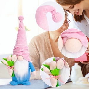 Detail shots of plush gnome gnome with pink dotted hat, white beard and fabric tulips