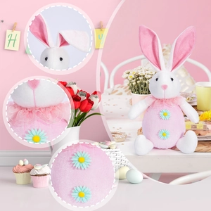 Detailed view of pink Easter bunny plush with lace collar and daisy embroidery