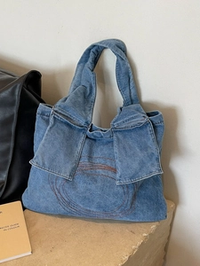Blue washed denim tote bag with vintage circular embroidery for women daily commute