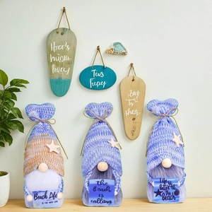 Three nautical beach gnomes with starfish hats and wood hanging signs for home decor