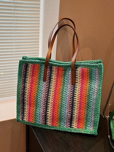 Colorful striped woven straw tote bag with brown leather handles for summer fashion
