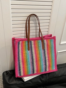 Rainbow striped woven tote bag with pink trim and dark brown shoulder straps