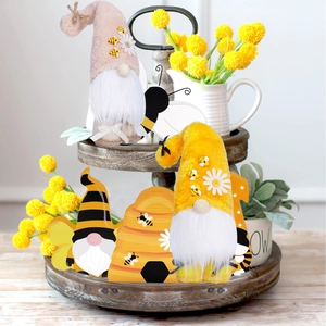 Detailed view of bee gnome plush toys and wooden sunflower tier tray decorations