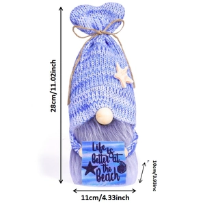 Detail of beach gnome with Life is Better at the Beach sign and sea star decoration