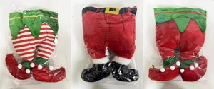 Detailed close-up of velvet Christmas elf and Santa legs ornaments with metallic bells