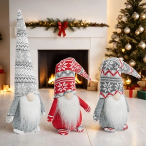 Detailed view of three festive Christmas gnomes with knitted snowflake pattern hats