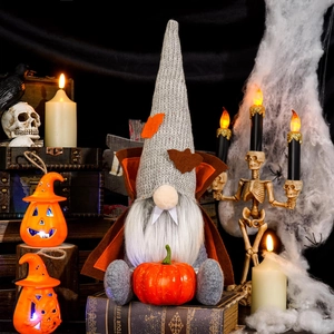 Halloween vampire gnome plush holding pumpkin in a spooky dark festive background