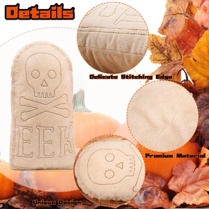 Detail of Halloween tombstone plush featuring embroidered skull, crossbones and EEK text