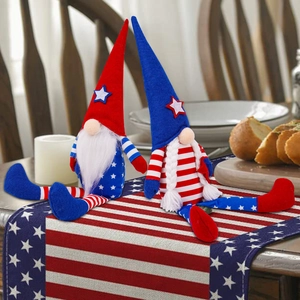 Pair of Independence Day gnomes with stars and stripes pattern on a festive table