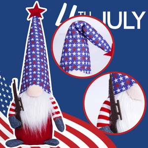 Detail of 4th July gnome plush with stars and stripes pattern holding a miniature rifle