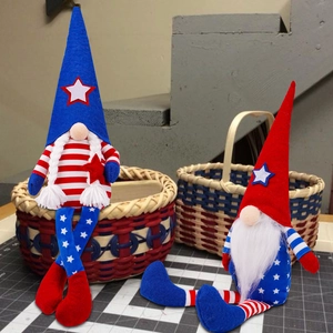 Detail of long-legged Independence Day gnomes with American flag patterns in a home setting