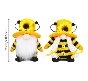 Detailed view of two bee themed gnomes with sunflower hats measuring 20cm in height