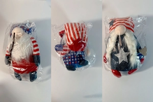 Detailed view of three Patriotic Gnomes in plastic packaging for Independence Day gifts