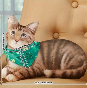 Detailed size view of tabby cat throw pillow with green clover scarf on a beige sofa