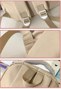 Detail of beige backpack featuring reinforced stitching and breathable mesh shoulder straps