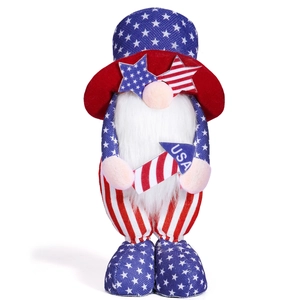 Close-up of USA Independence Day gnome with patriotic star glasses and rocket decoration