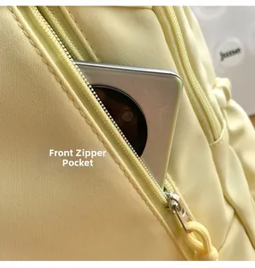 Detailed front zipper pocket showing large capacity with phone storage in nylon backpack