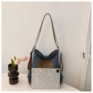 Detail view of denim canvas tote bag interior space showing capacity for a tablet device