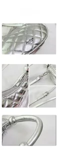 Detail of silver quilted dumpling bag with metallic texture and Fashion BAG logo