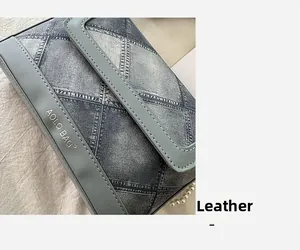 Detail of denim-texture leather bucket bag with pearl chain and AOLO BAG branding
