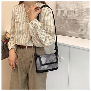 Detail of Korean style crossbody bucket bag with pearl pendant and diamond stitching