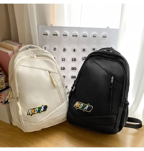 Close-up of RKDBAG canvas backpacks with side pockets and front zipper pockets