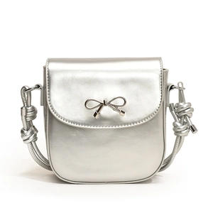Chic silver PU leather crossbody bag featuring a stylish metallic bow accent