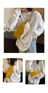 Details der gelb-beigen Canvas-Brusttasche mit breitem Gurt und dekorativem Reißverschluss