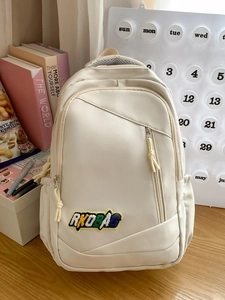 Minimalist beige large capacity campus backpack with letter patch and durable zipper