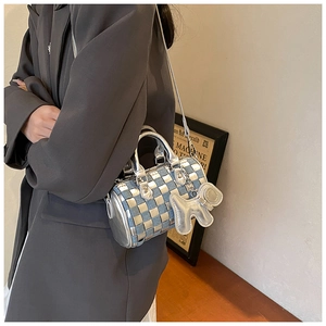 Mini checkerboard cylinder bag in blue and silver with metallic handles and dog charm