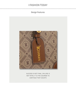 Macro shot of brown monogram bucket bag detailing leather tag and metallic hardware