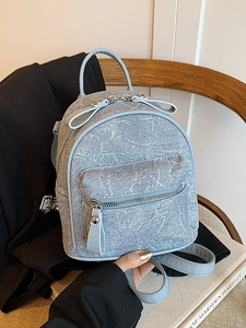Chic light blue denim mini backpack with marble texture and adjustable leather straps
