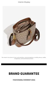 Detailed interior of vintage bucket bag showing three compartments and wide shoulder strap