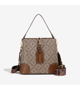 Detail of vintage monogram bucket bag with brown leather trim and jacquard wide strap