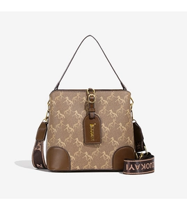 Macro view of the retro bucket bag showing vintage horse pattern and branded woven strap